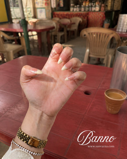 Minimani Banno bow press-on nails worn on hand