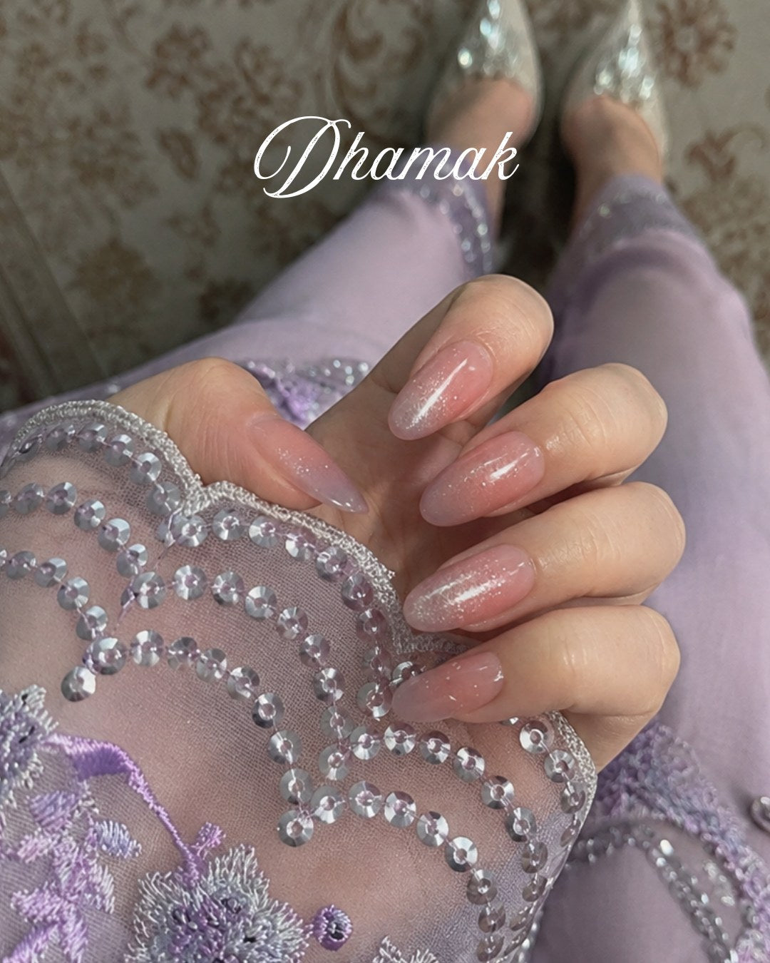 Minimani Dhamak pink cat-eye press-on nails worn on hand